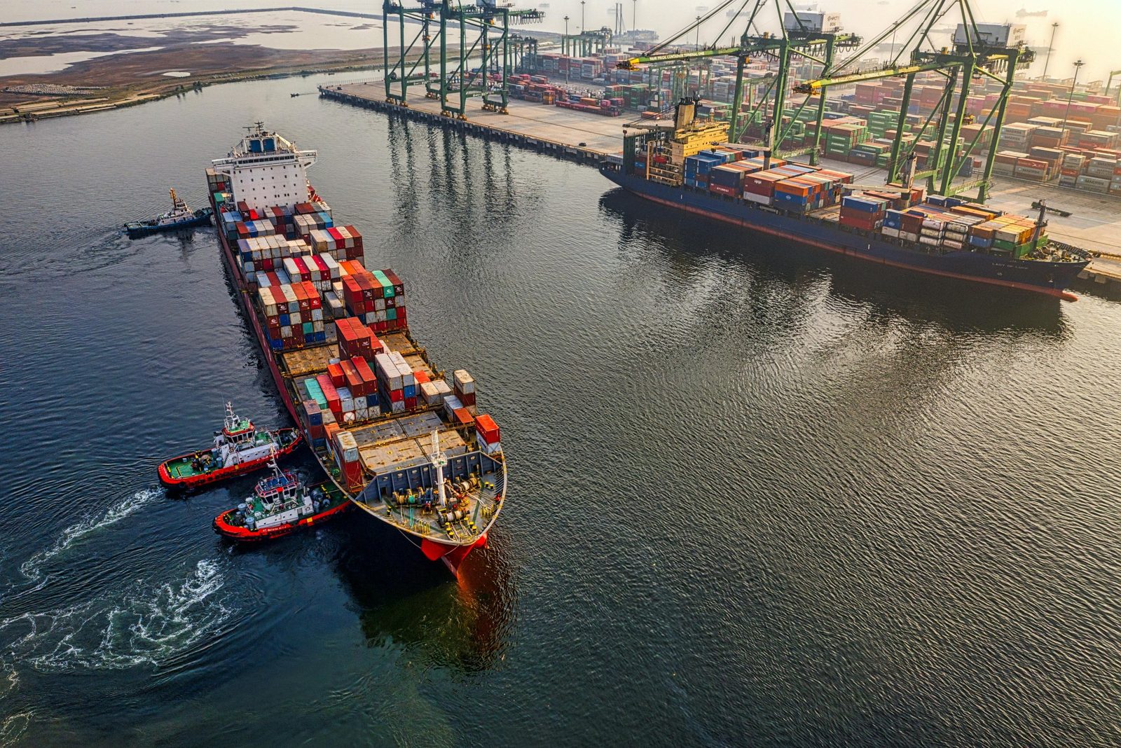 Cargo vessel representing international vehicle shipping and port costs